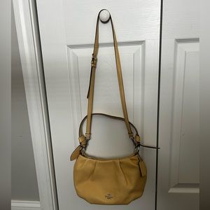 Light Yellow Coach Corssbody bag with matching Wristlet